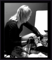 Sky Williams tattooing in the studio